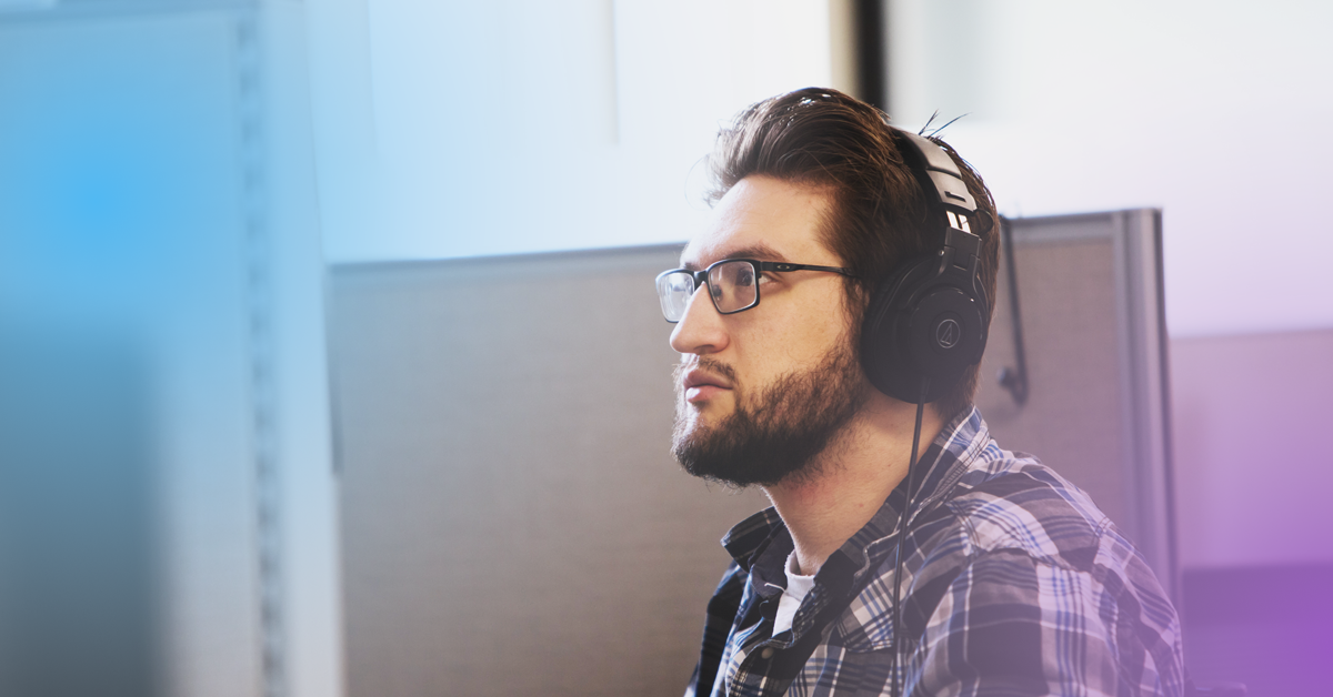 A professional in a call with headphones on